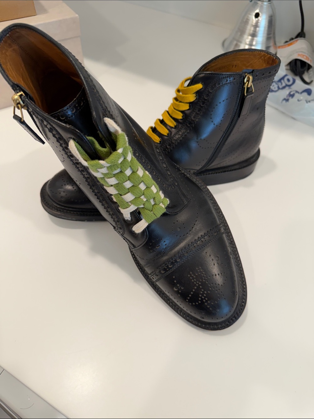 Men's GucciBlack Leather Wingtip Zip Boots with Green Accent Laces